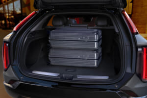 View of the 2025 Cadillac OPTIQ rear cargo area with the rear hatch opened, showing its segment-best cargo capacity.